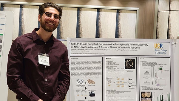 UCR BCOE bioengineering PhD student Nicholas Robertson at a poster presentation.