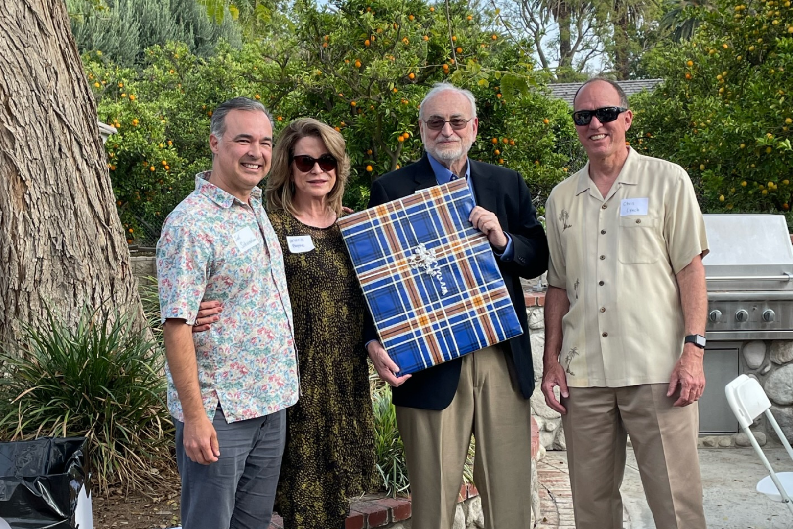 Dean Lynch and Assistant Dean Schwendiman present the gift to Tom and Valerie.