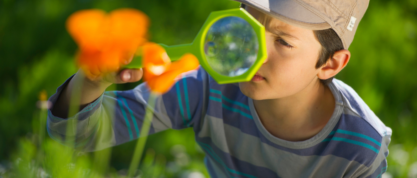 kid with magnifying glass