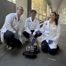 aiche members demonstrating the chem-e vehicle