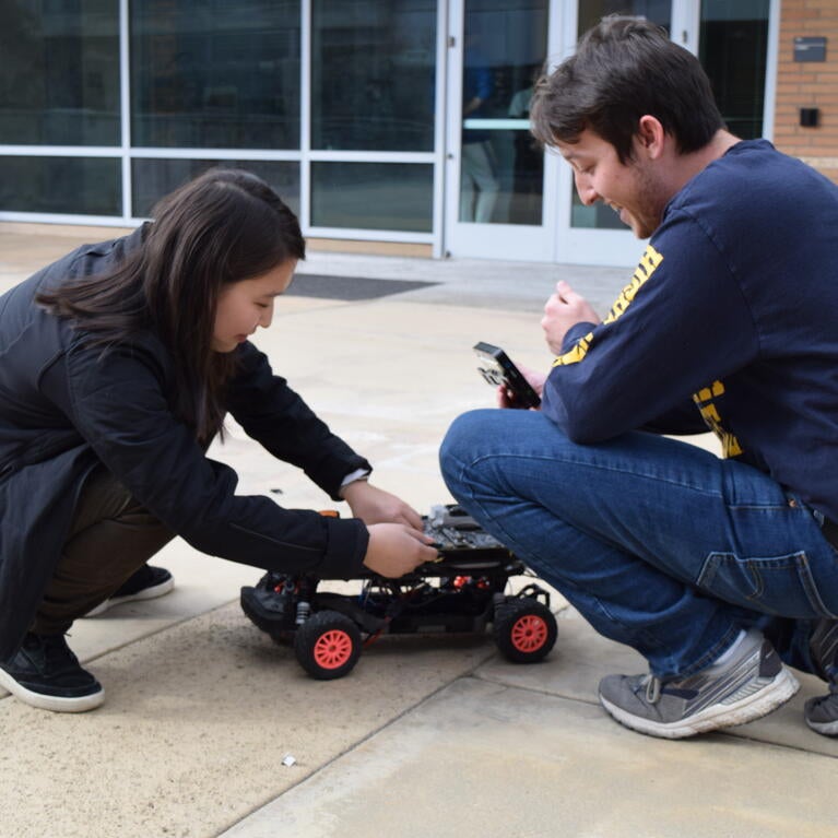 students working on robot