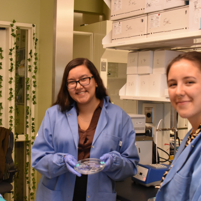 Three student researchers in the lab