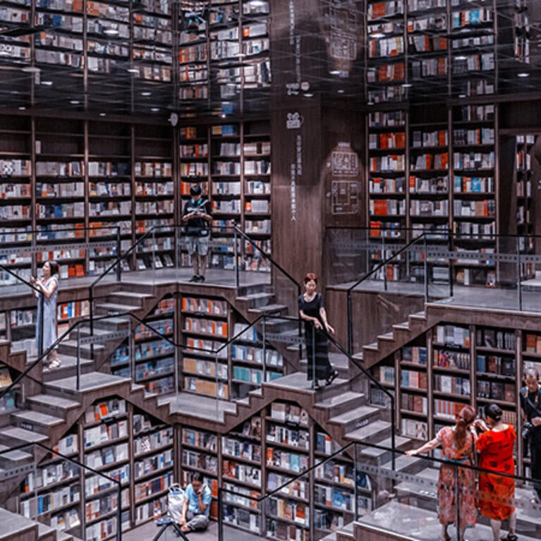 Digital illustration of interior of library containing enormous amount of books.