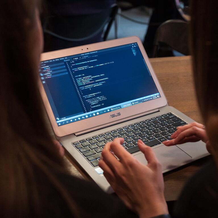 Two girls coding