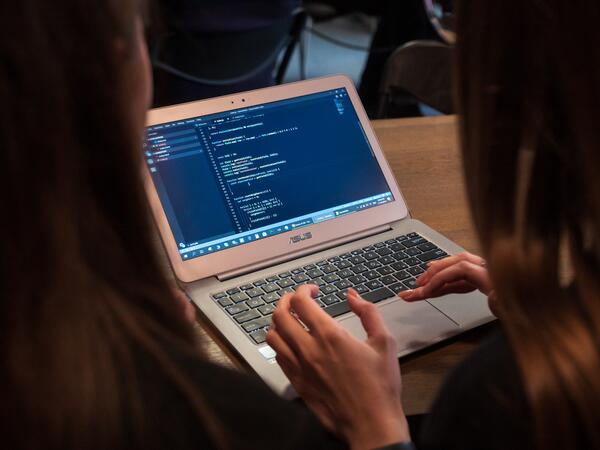 Two girls coding
